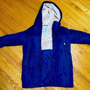 Kids Blue Winder Jacket.. Puffy on the inside very warm. Brand Zara